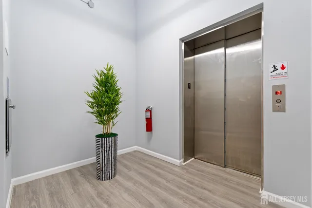 a view of a kitchen with a refrigerator and a dishwasher