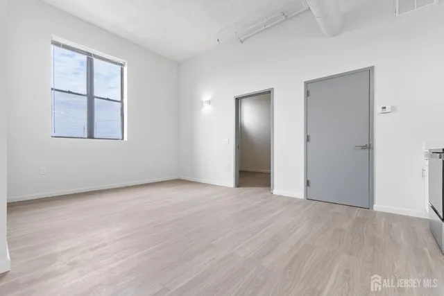 a view of hallway with wooden floor