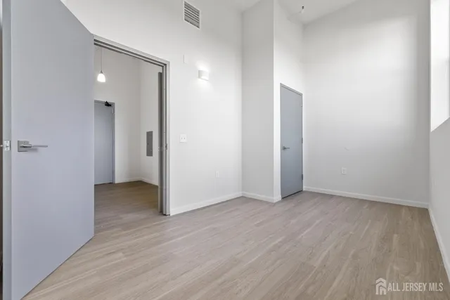 a view of washer and dryer with kitchen in the background