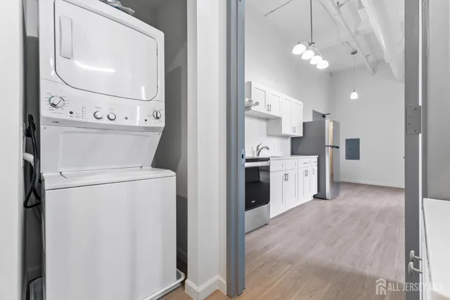 a kitchen with a stove sink and refrigerator