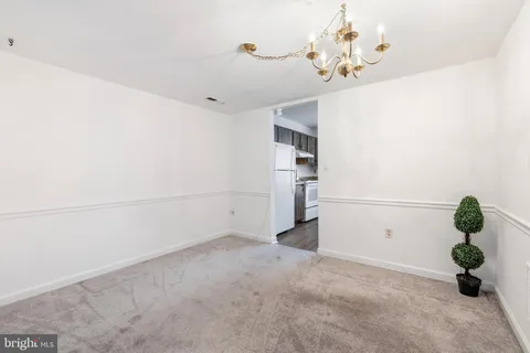 a view of a chandelier and closet in a room