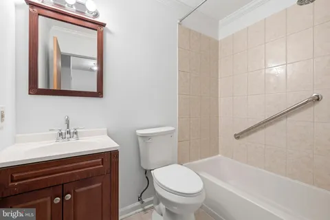 a bathroom with a sink toilet and vanity