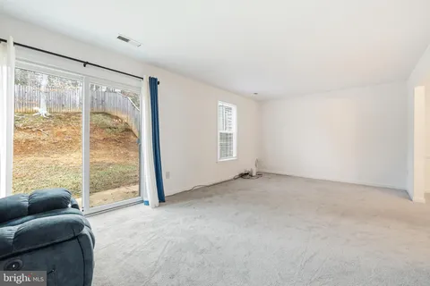 a view of livingroom with furniture and front door