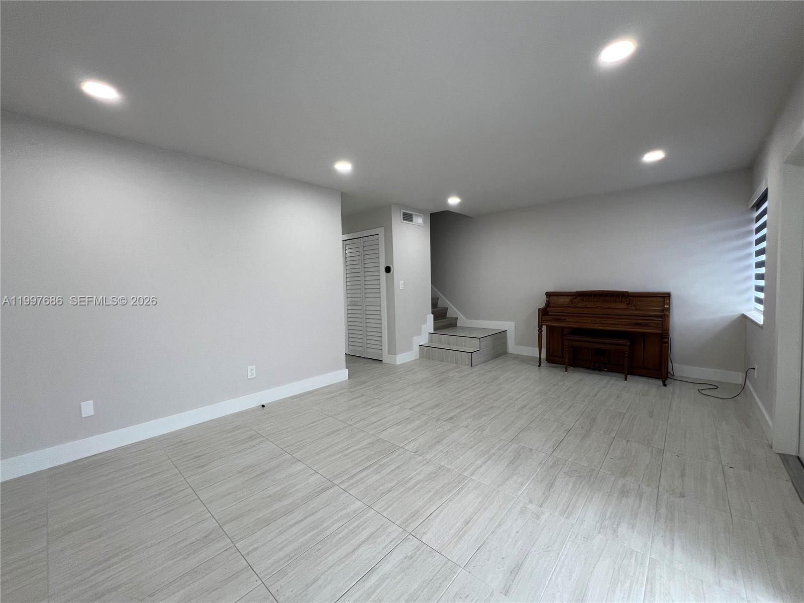 3826 Southwest 107th Avenue, Unit 22 Miami, FL 33165 - Photo 12 of 18 a view of empty room with wooden floor