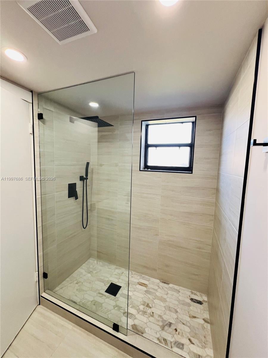 3826 Southwest 107th Avenue, Unit 22 Miami, FL 33165 - Photo 6 of 18 a bathroom with a shower