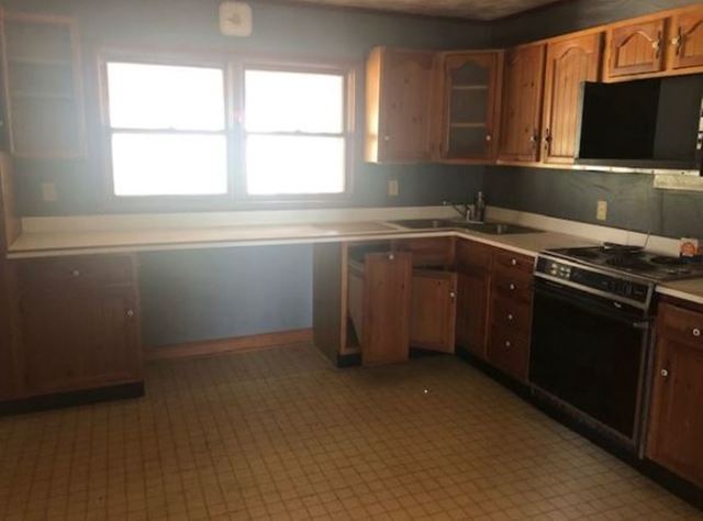 20401 Bluff Road Frederick, IL 62639 - Photo 4 of 9 a kitchen with a sink and a window