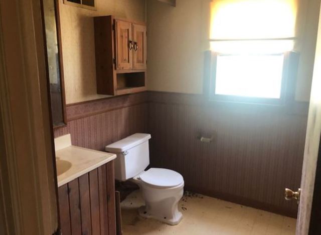 20401 Bluff Road Frederick, IL 62639 - Photo 9 of 9 a white toilet sitting next to a bathroom sink