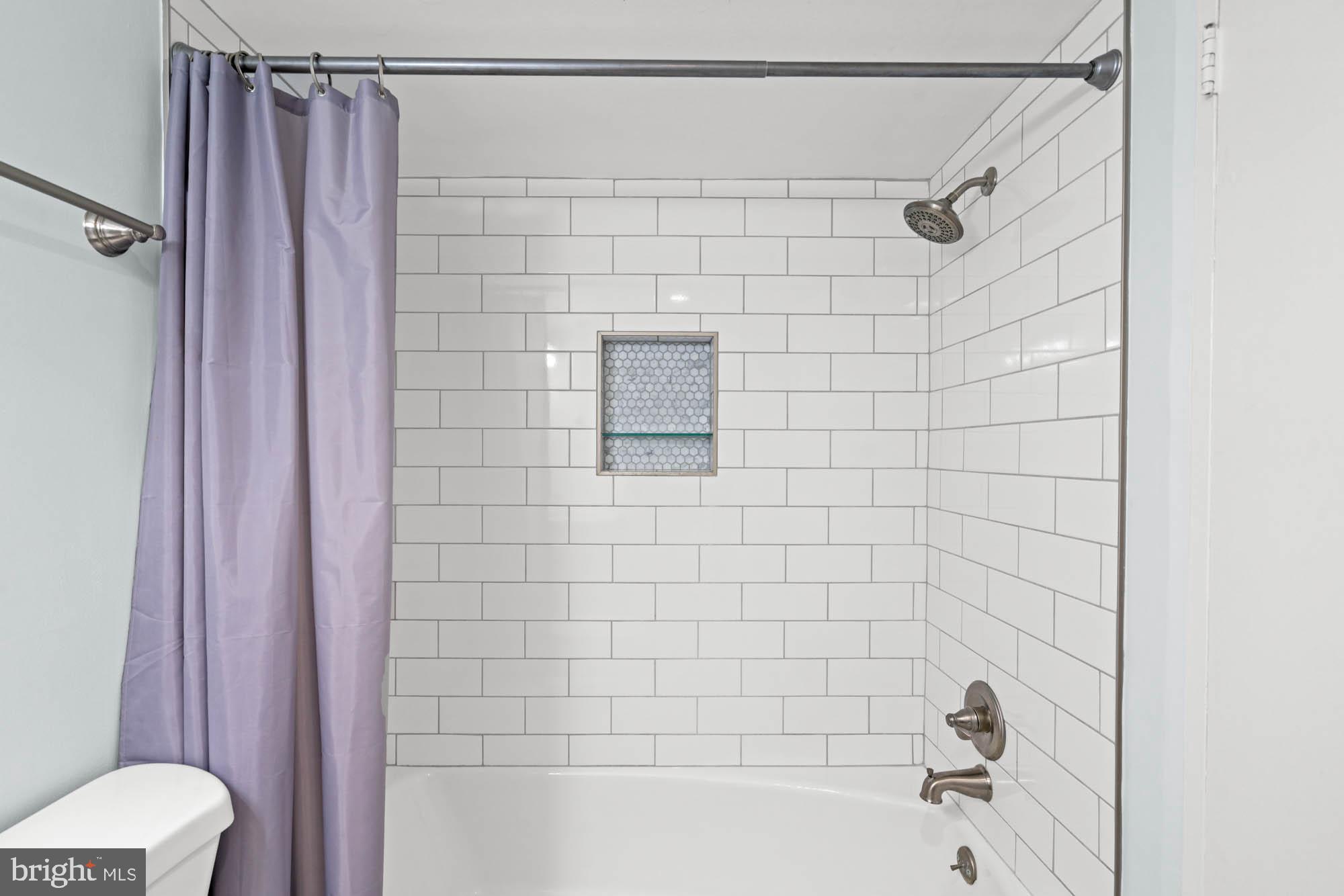 5101 River Road, Unit 1217 Bethesda, MD 20816 - Photo 43 of 61 Newly tiled tub and shower w/ niche