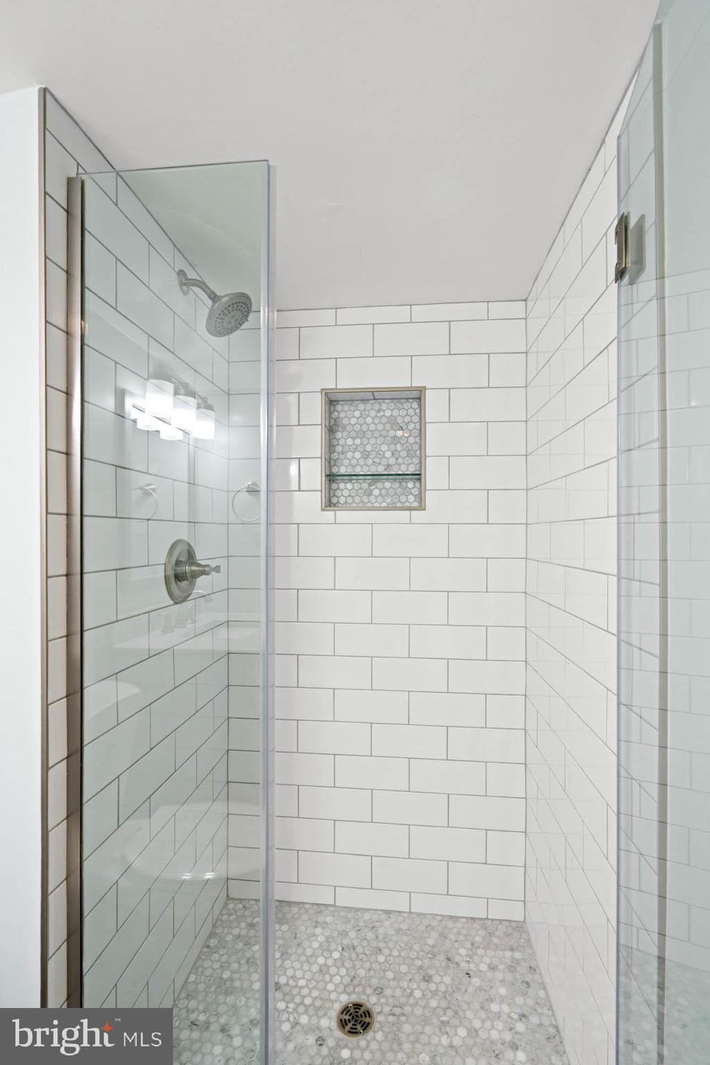 5101 River Road, Unit 1217 Bethesda, MD 20816 - Photo 51 of 61 Walk-in shower with subway tile & niche