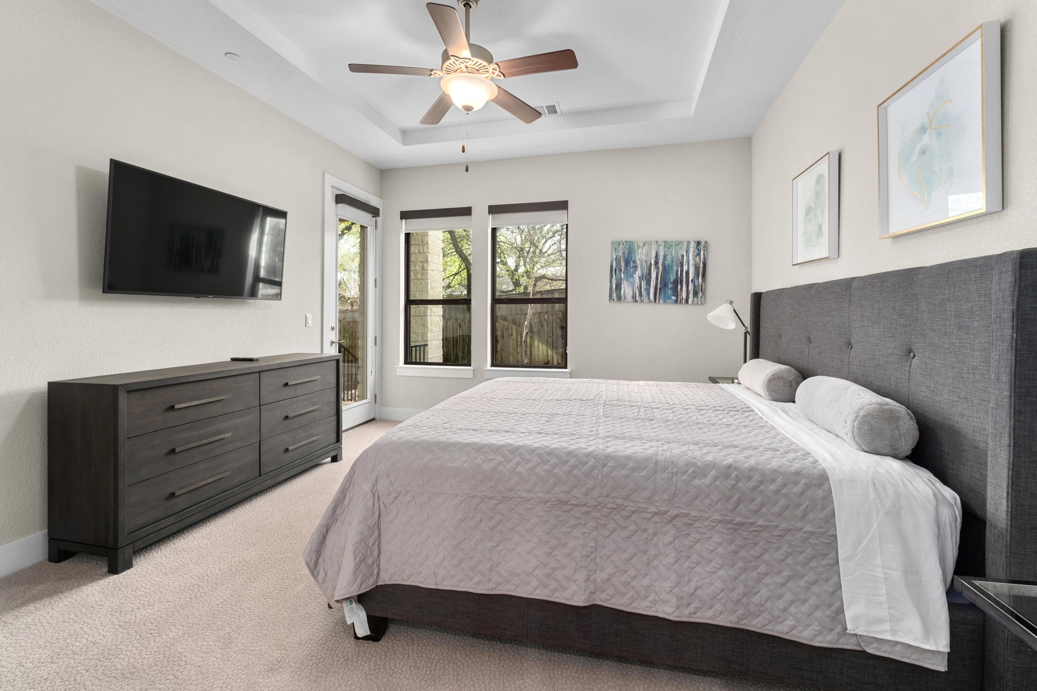 4323 Spicewood Springs Road, Unit 2 Austin, TX 78759 - Photo 12 of 30 Bedroom with light colored carpet, ceiling fan, a tray ceiling, and access to outside