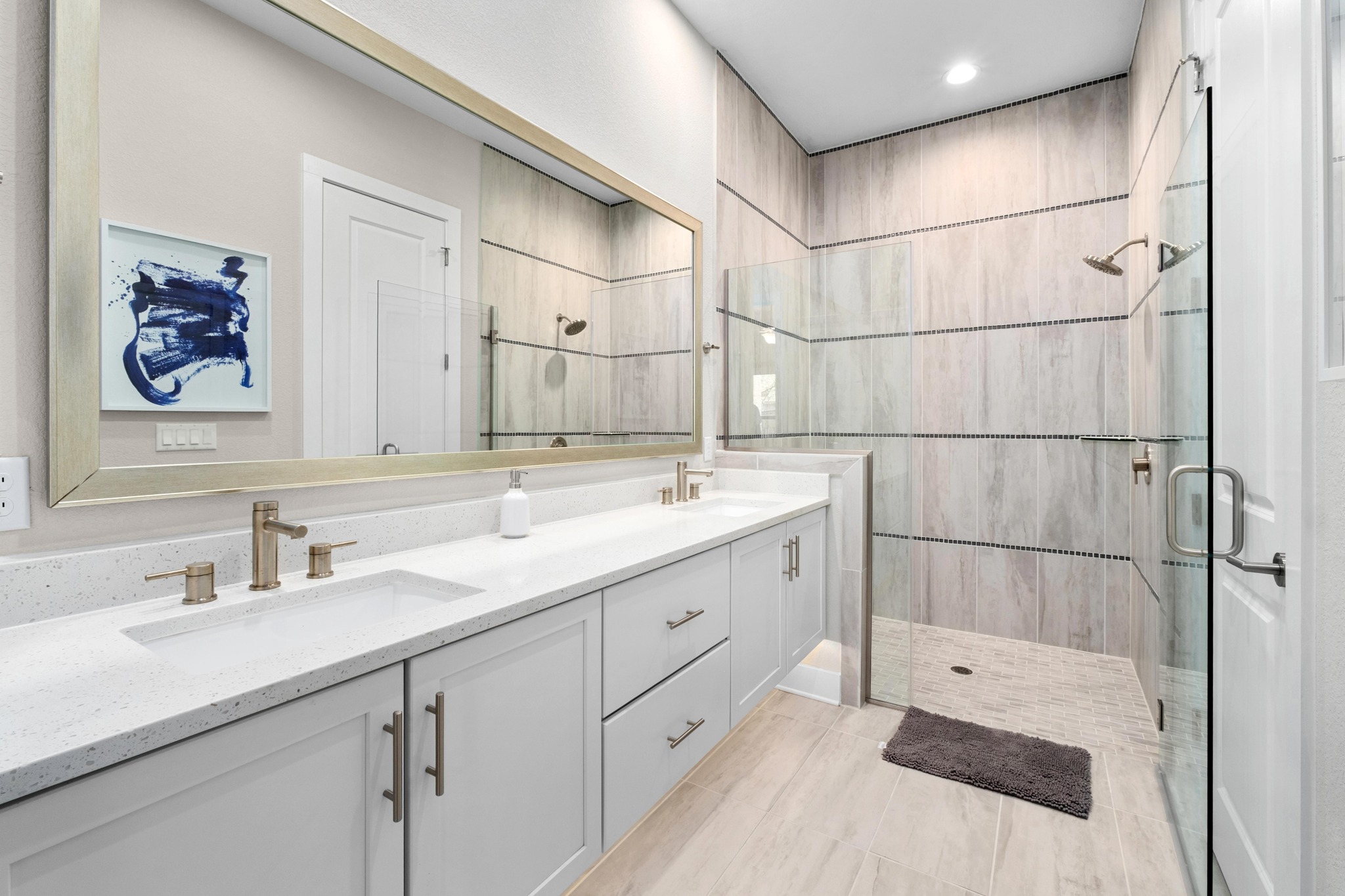 4323 Spicewood Springs Road, Unit 2 Austin, TX 78759 - Photo 13 of 30 Full bathroom featuring double vanity and a stall shower