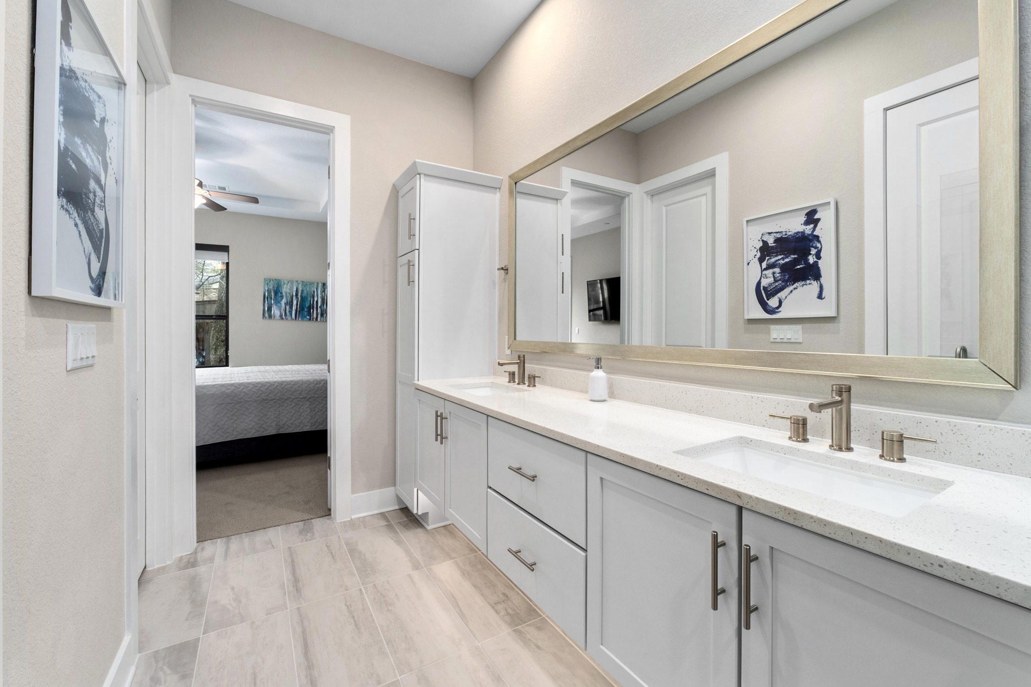 4323 Spicewood Springs Road, Unit 2 Austin, TX 78759 - Photo 14 of 30 Full bath with double vanity, connected bathroom, and ceiling fan