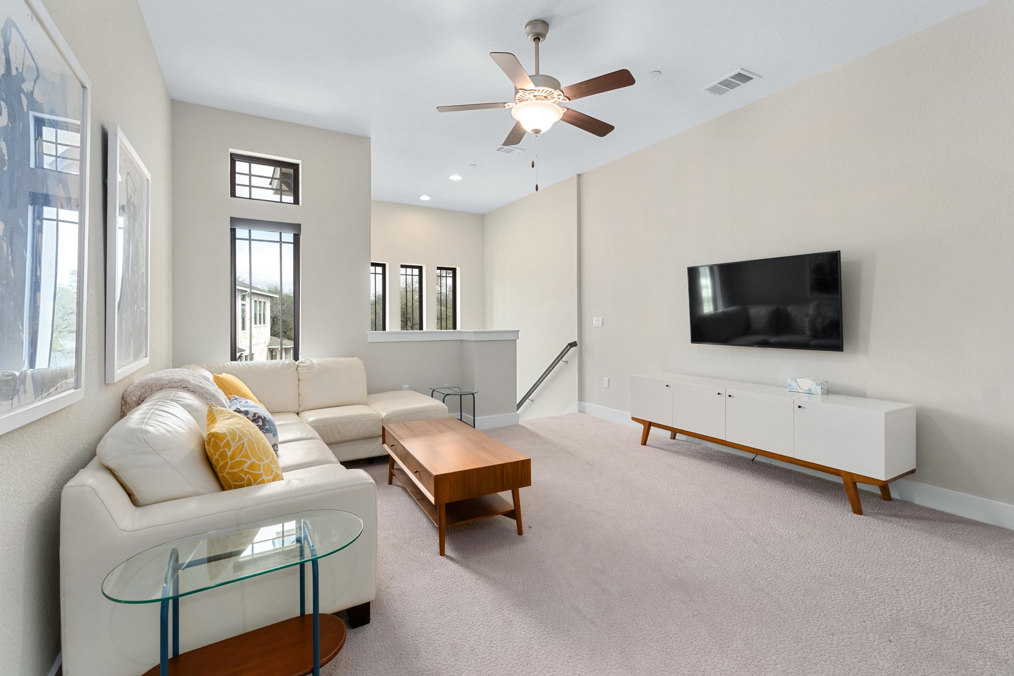 4323 Spicewood Springs Road, Unit 2 Austin, TX 78759 - Photo 17 of 30 Carpeted living room with ceiling fan and baseboards