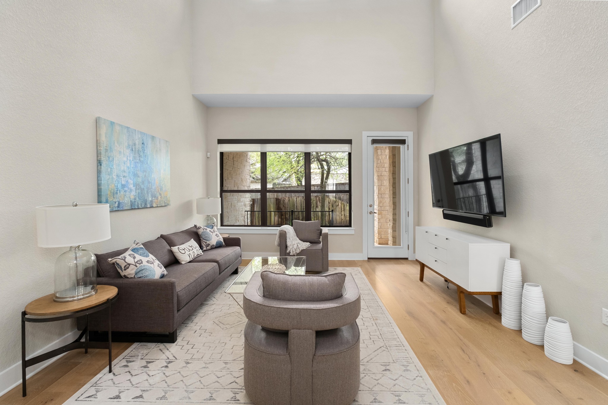 4323 Spicewood Springs Road, Unit 2 Austin, TX 78759 - Photo 6 of 30 Living room with a high ceiling and light wood finished floors