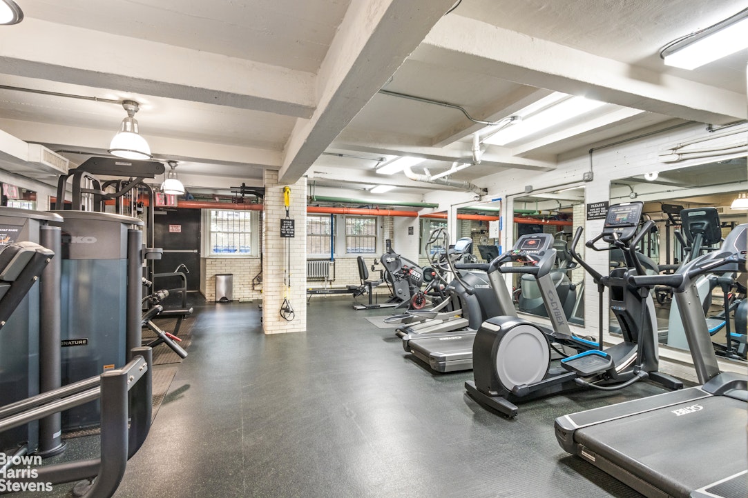 315 East 68th Street, Unit 13F Manhattan, NY 10065 - Photo 12 of 16 a view of a room with gym equipment
