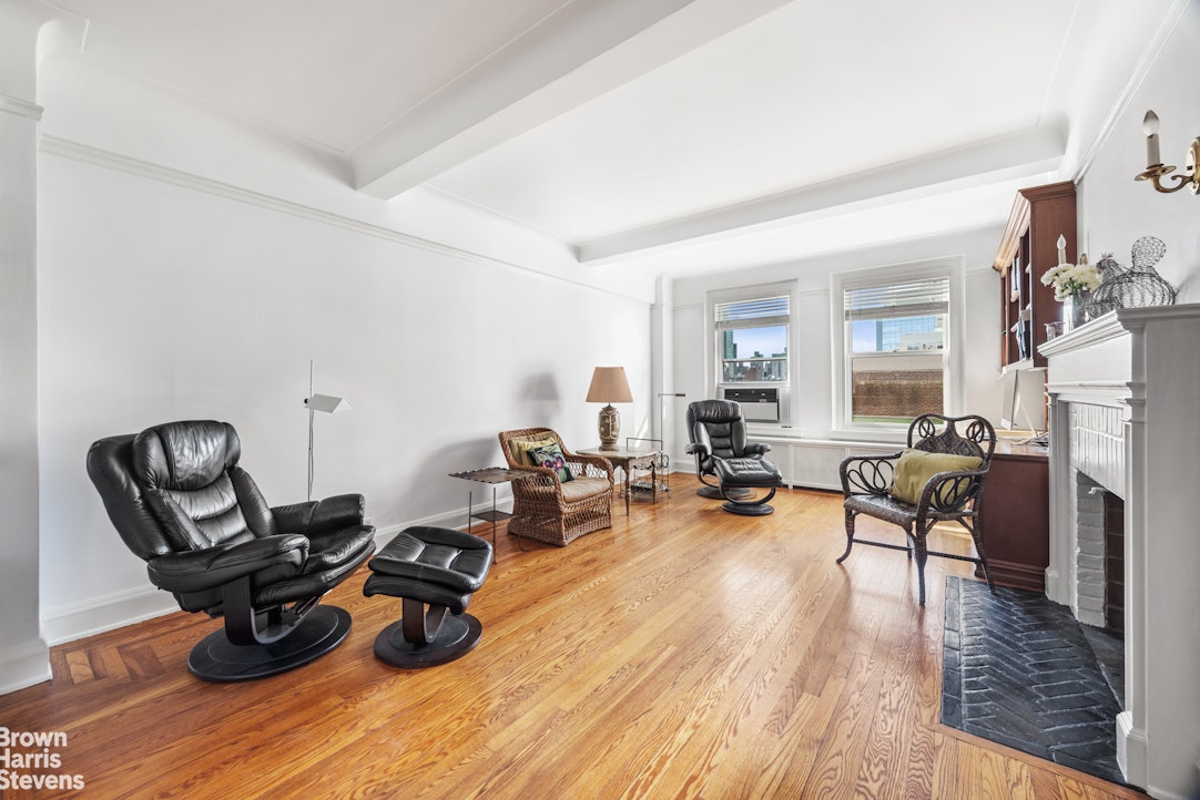 315 East 68th Street, Unit 13F Manhattan, NY 10065 - Photo 2 of 16 a living room with furniture and wooden floor