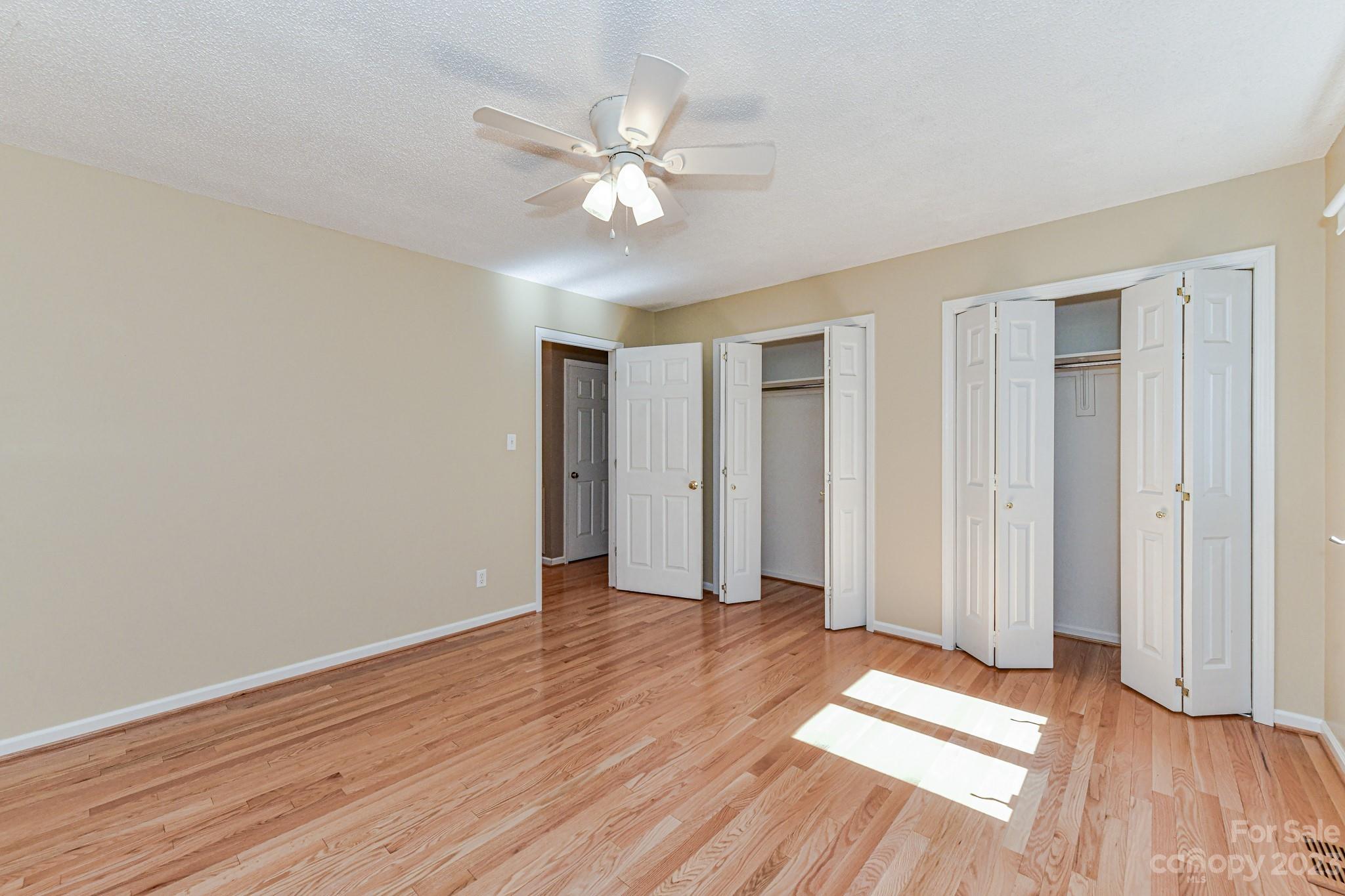 4690 Davidson Road Davidson, NC 28036 - Photo 19 of 29 a view of an empty room with wooden floor