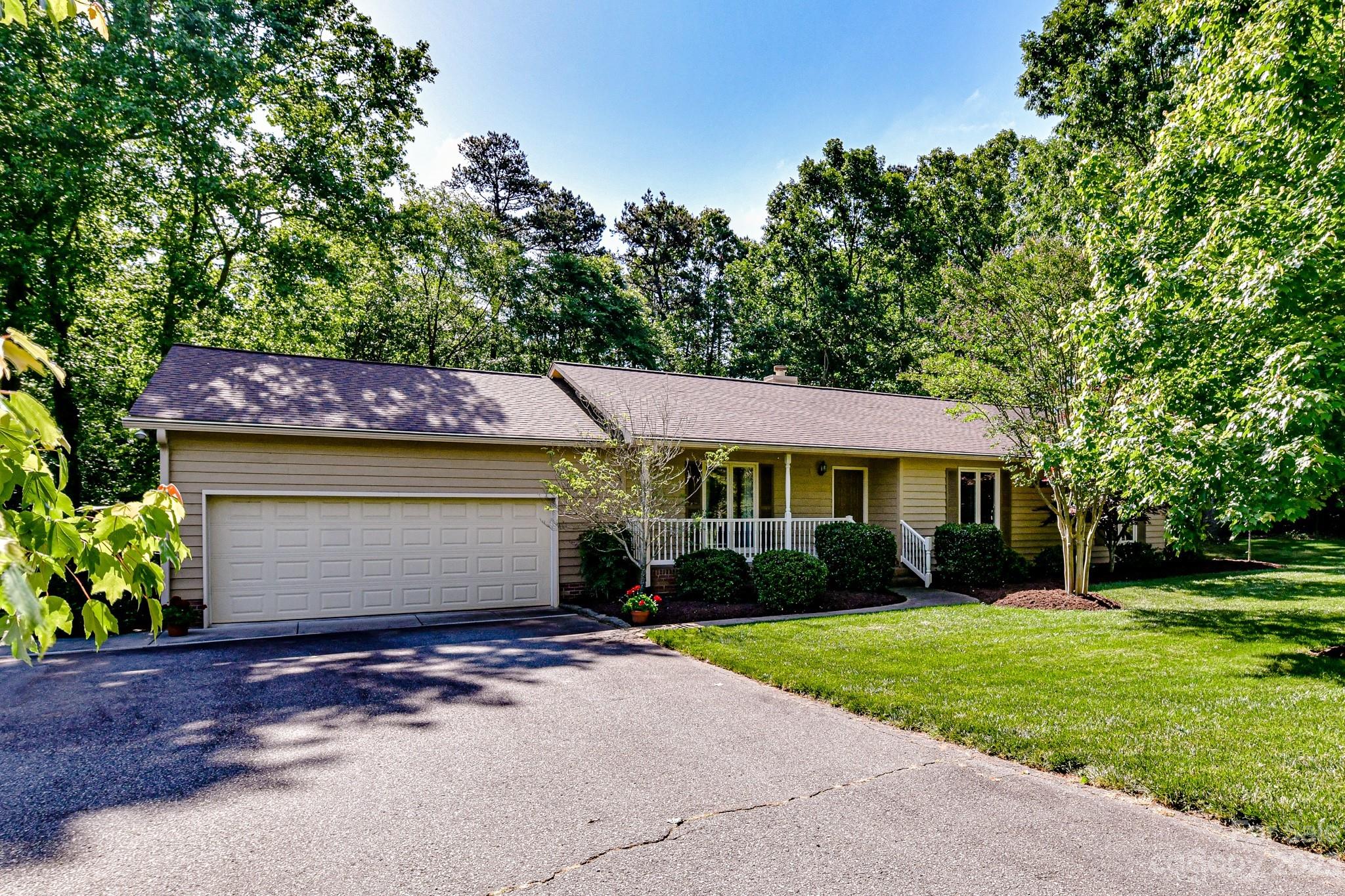 4690 Davidson Road Davidson, NC 28036 - Photo 2 of 29 a front view of a house with garden