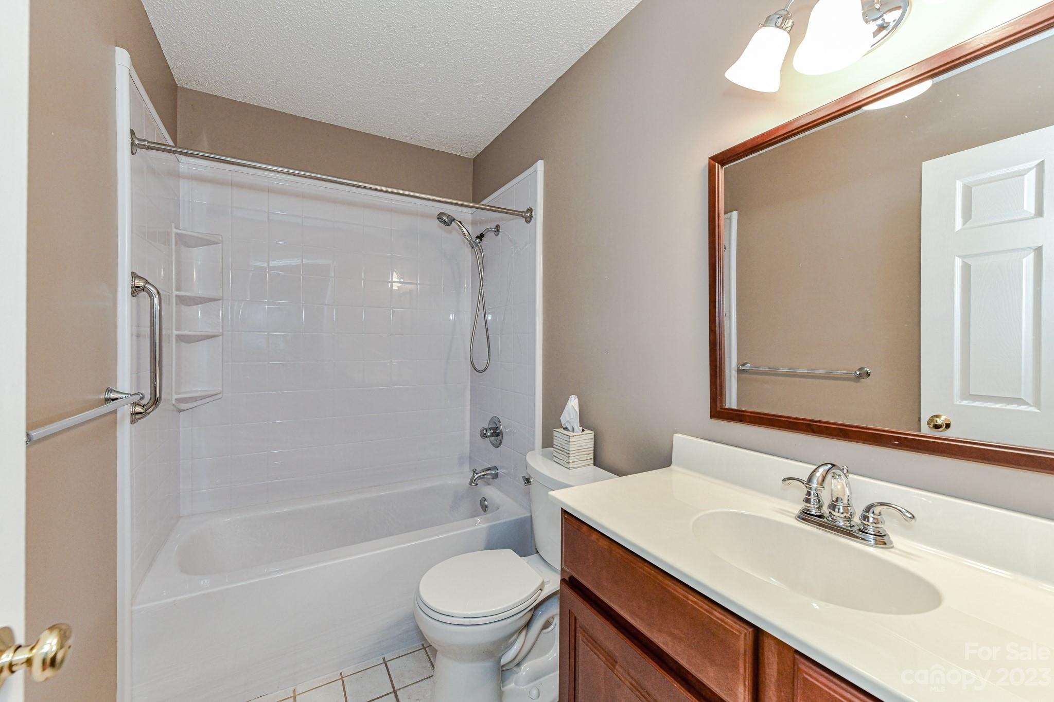 4690 Davidson Road Davidson, NC 28036 - Photo 21 of 29 a bathroom with a sink toilet and shower