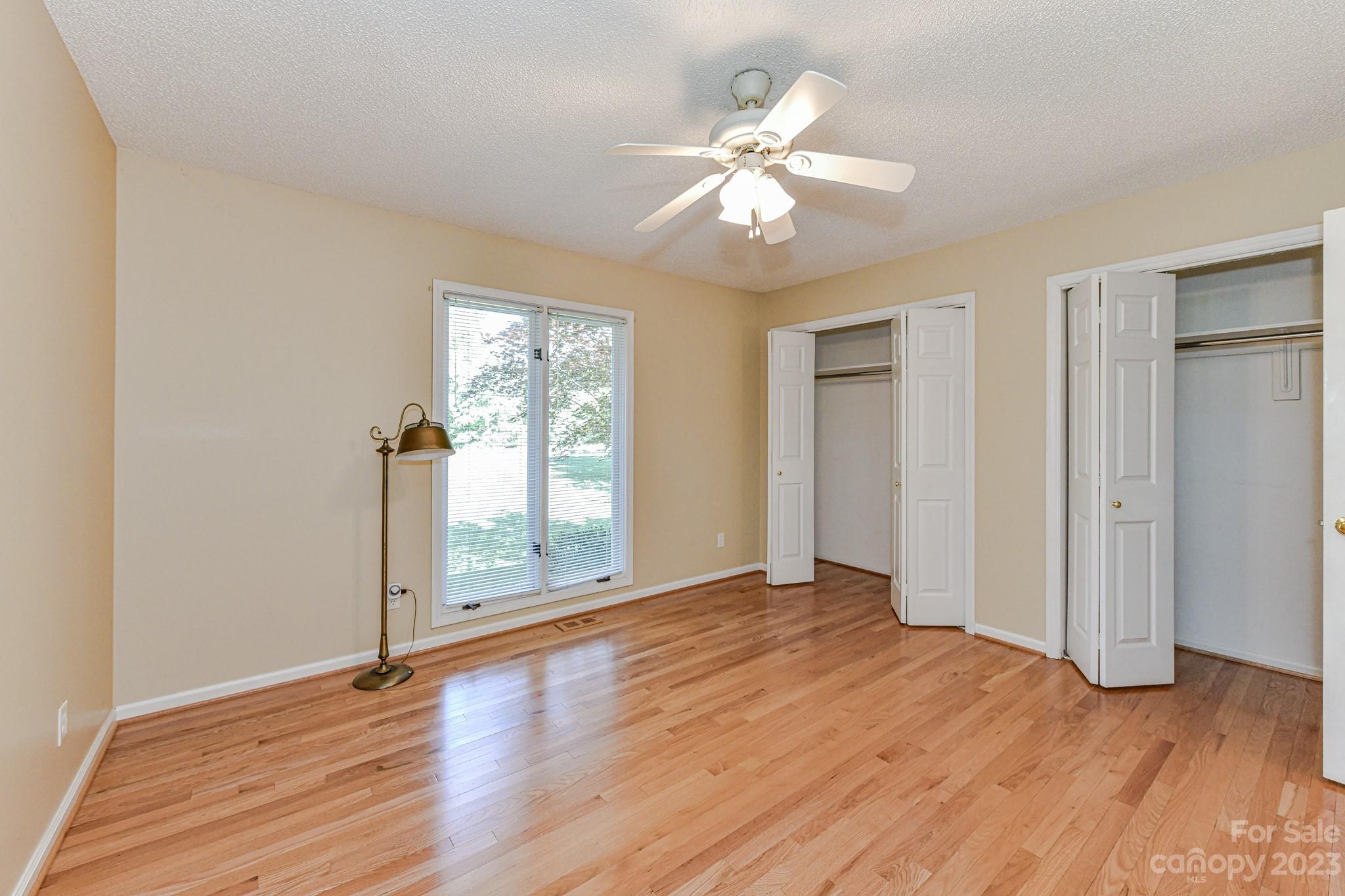 4690 Davidson Road Davidson, NC 28036 - Photo 22 of 29 a view of an empty room with wooden floor and window