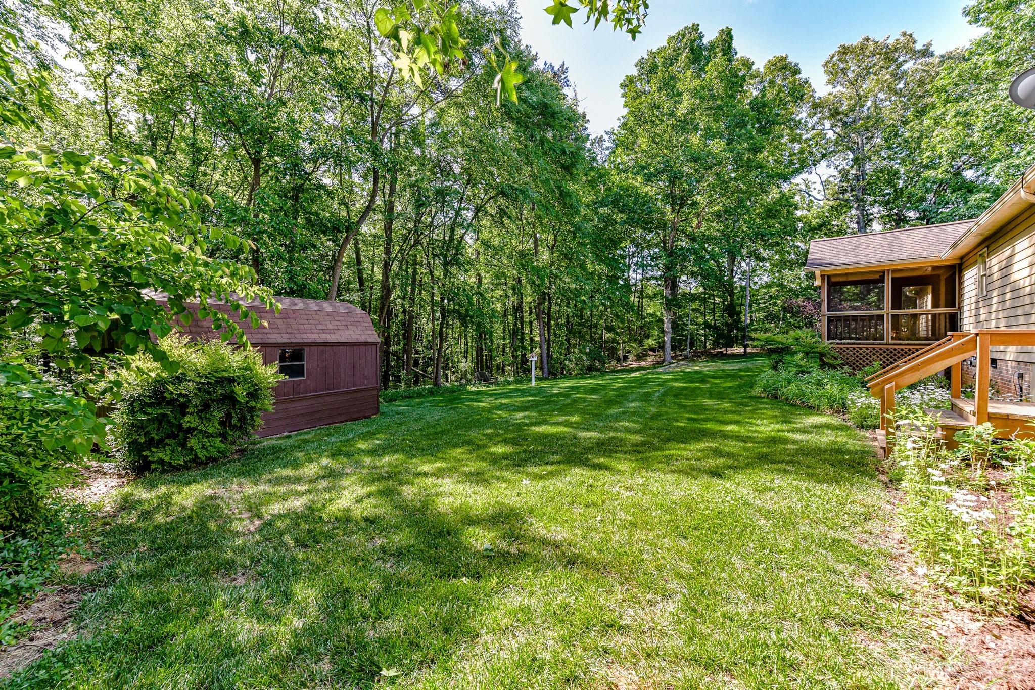 4690 Davidson Road Davidson, NC 28036 - Photo 26 of 29 a view of a house with a backyard