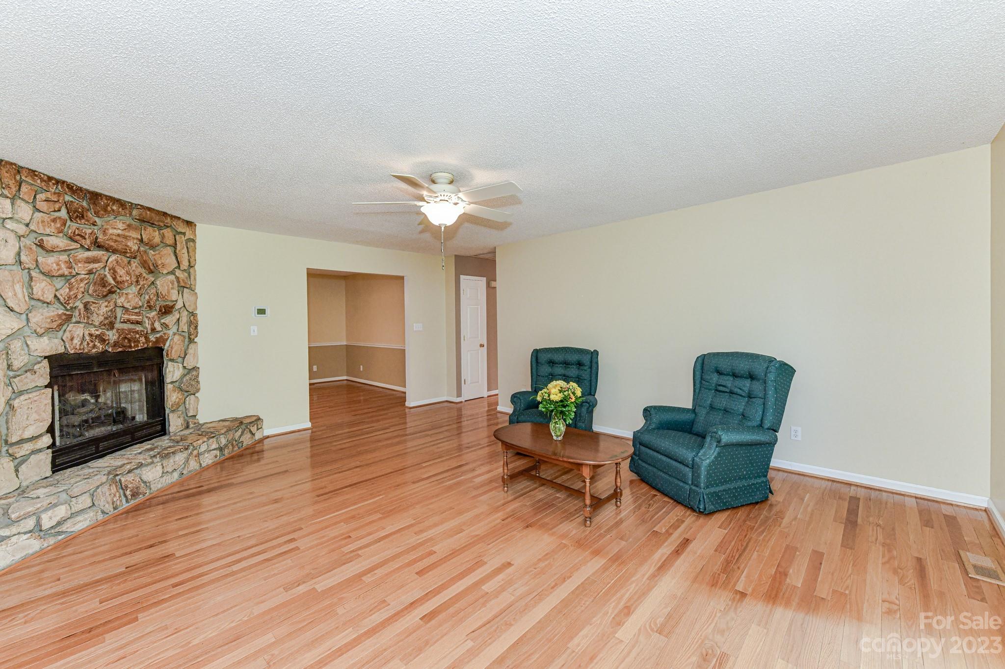 4690 Davidson Road Davidson, NC 28036 - Photo 7 of 29 a living room with furniture and a fireplace