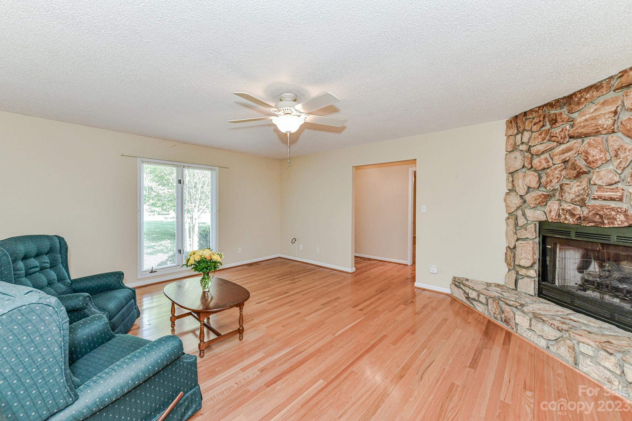 4690 Davidson Road Davidson, NC 28036 - Photo 8 of 29 a living room with furniture and a fireplace
