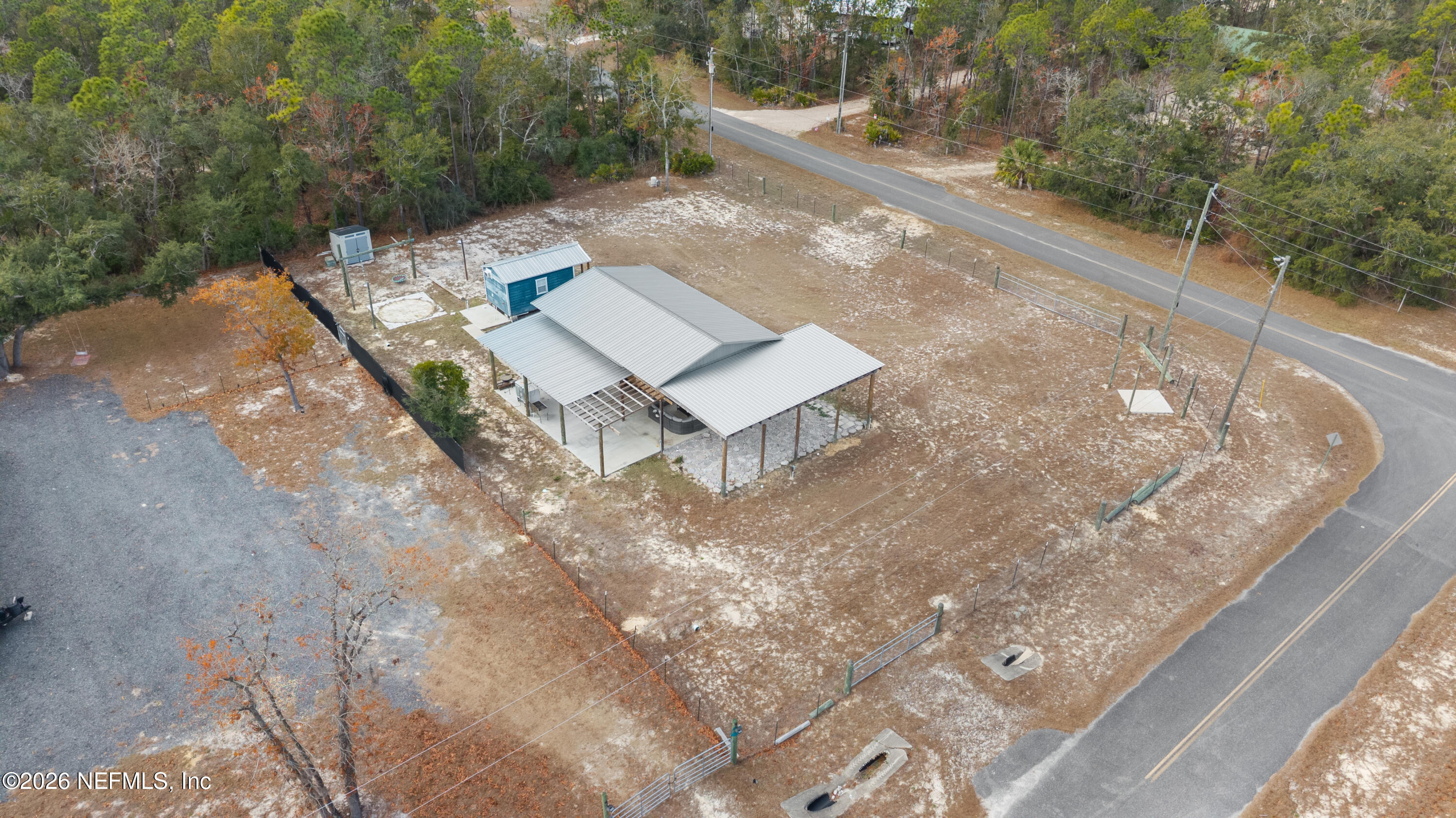 0 Bird Pond Road Northeast Steinhatchee, FL 32359 - Photo 14 of 15 a view of a backyard with wooden fence