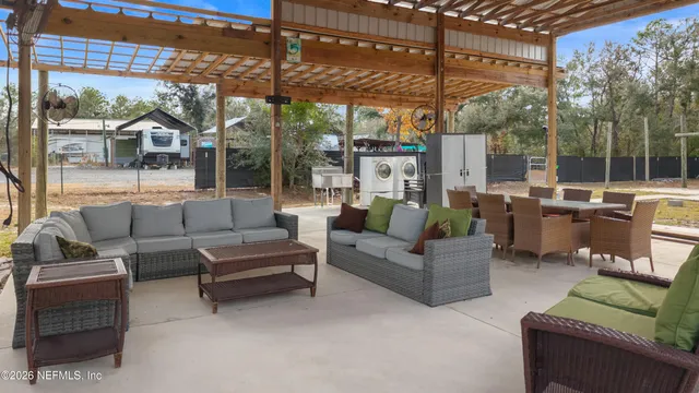 a outdoor living space with patio furniture and a potted plant
