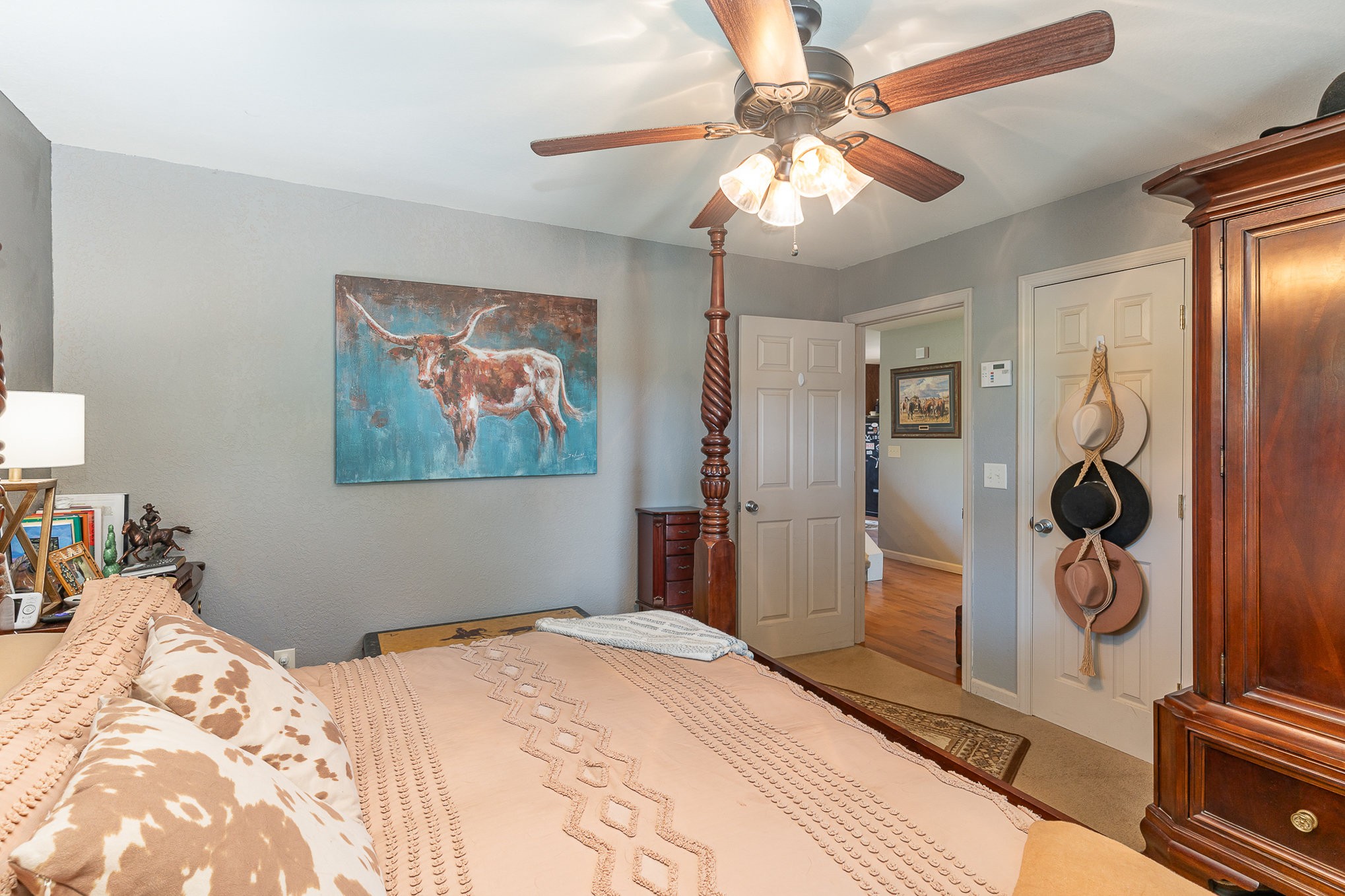 10919 Owens Chapel Road Springfield, TN 37172 - Photo 14 of 23 a bedroom with a bed and a chandelier