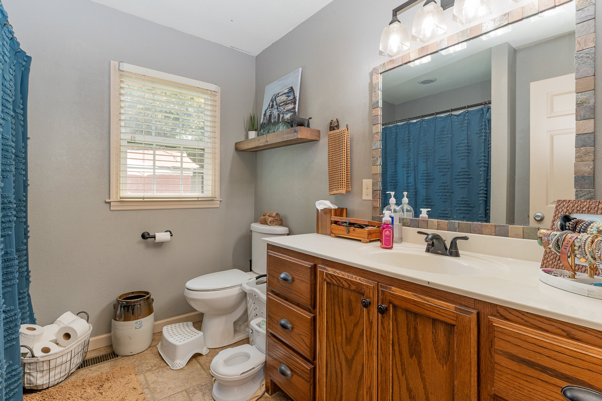 10919 Owens Chapel Road Springfield, TN 37172 - Photo 15 of 23 a bathroom with a granite countertop sink mirror vanity and toilet