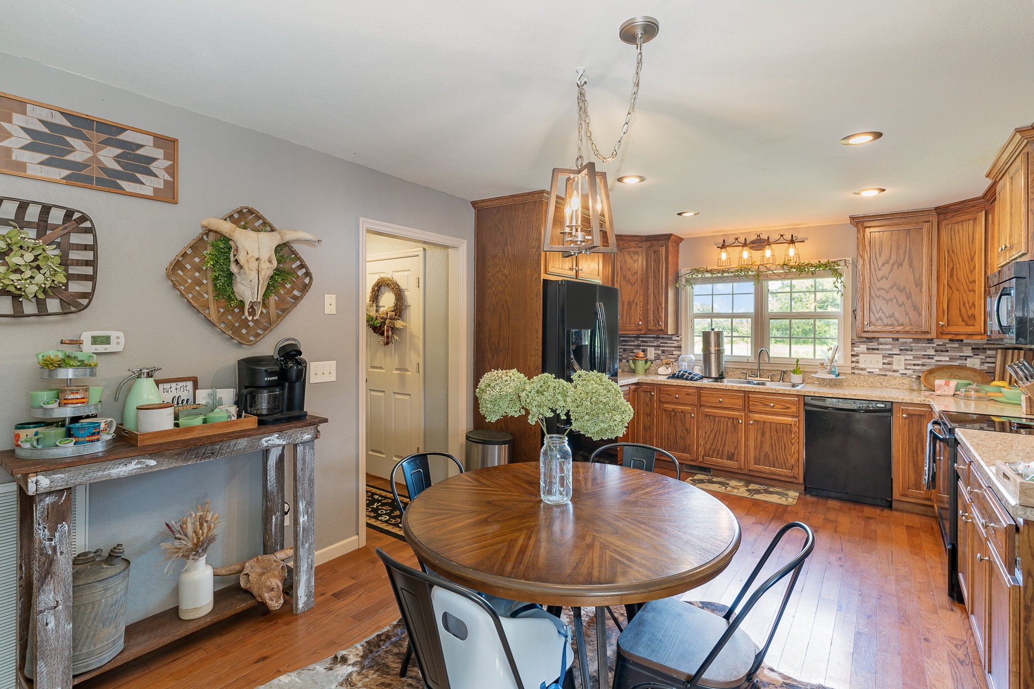 10919 Owens Chapel Road Springfield, TN 37172 - Photo 7 of 23 a view of a dining room with furniture window and wooden floor