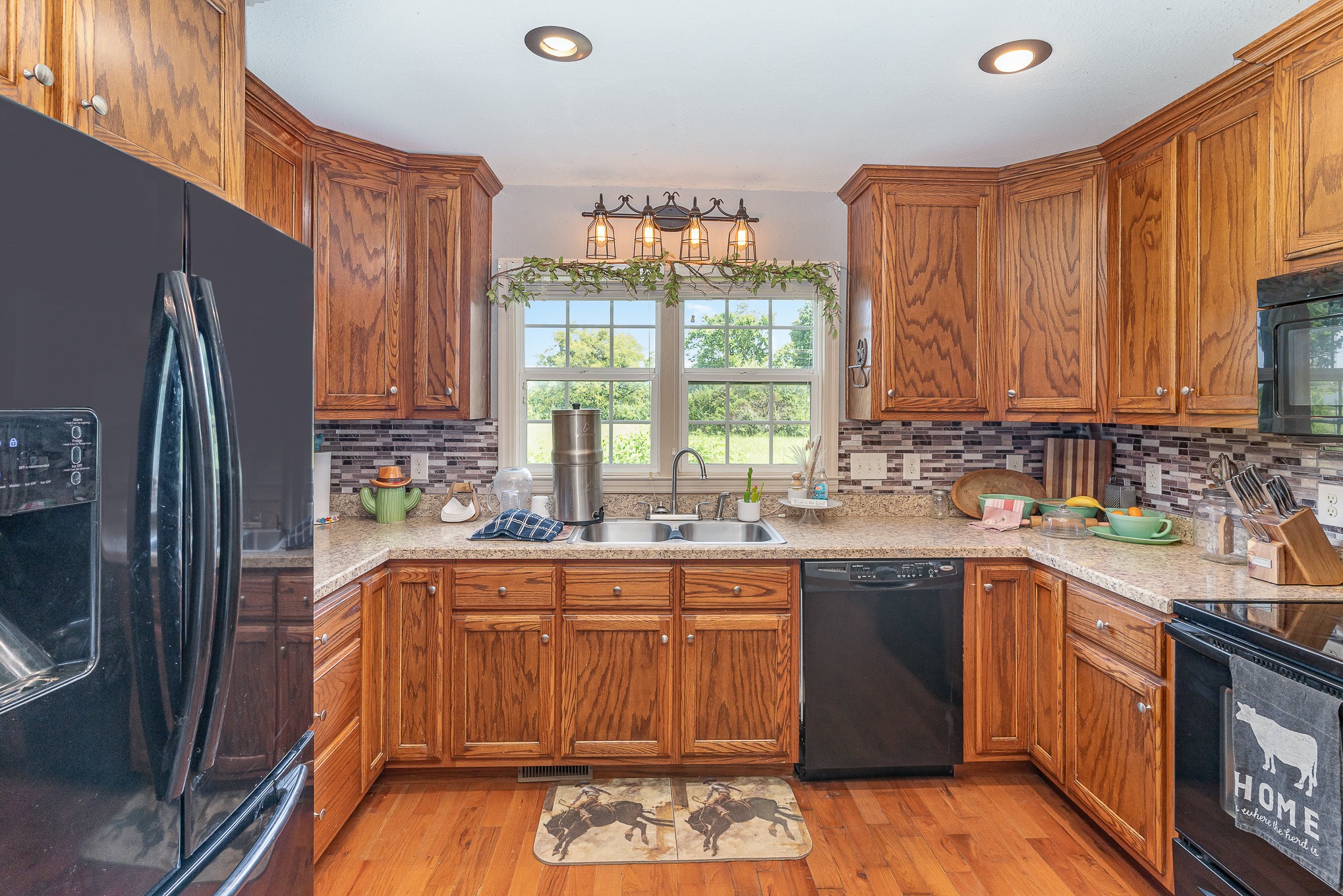 10919 Owens Chapel Road Springfield, TN 37172 - Photo 10 of 23 a kitchen with a sink stove and refrigerator