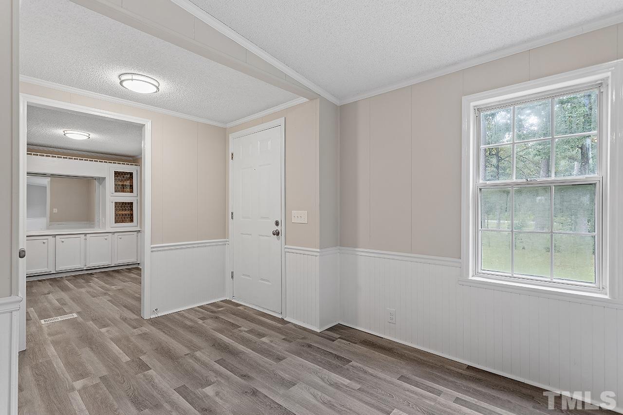 1002 Autry Road Lillington, NC 27546 - Photo 16 of 38 wooden floor in an empty room with a window