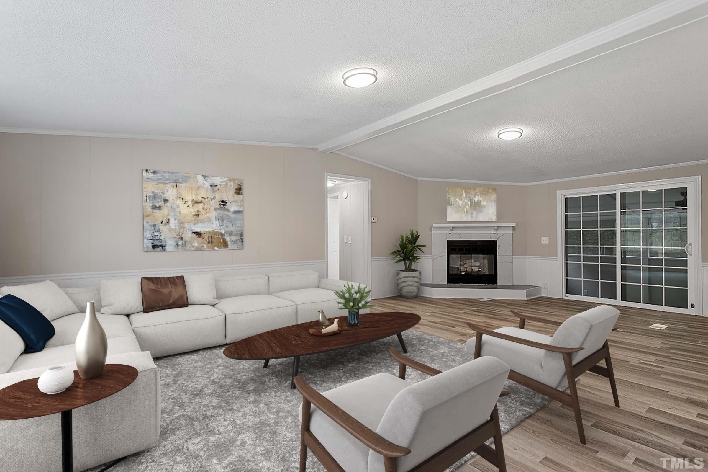 1002 Autry Road Lillington, NC 27546 - Photo 2 of 38 a living room with furniture and a fireplace