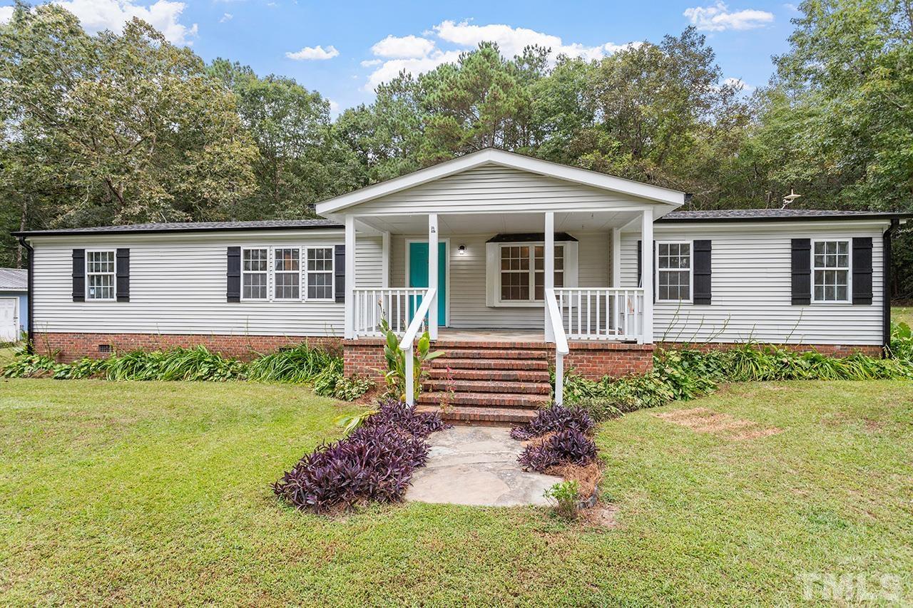 1002 Autry Road Lillington, NC 27546 - Photo 26 of 38 a front view of a house with a yard
