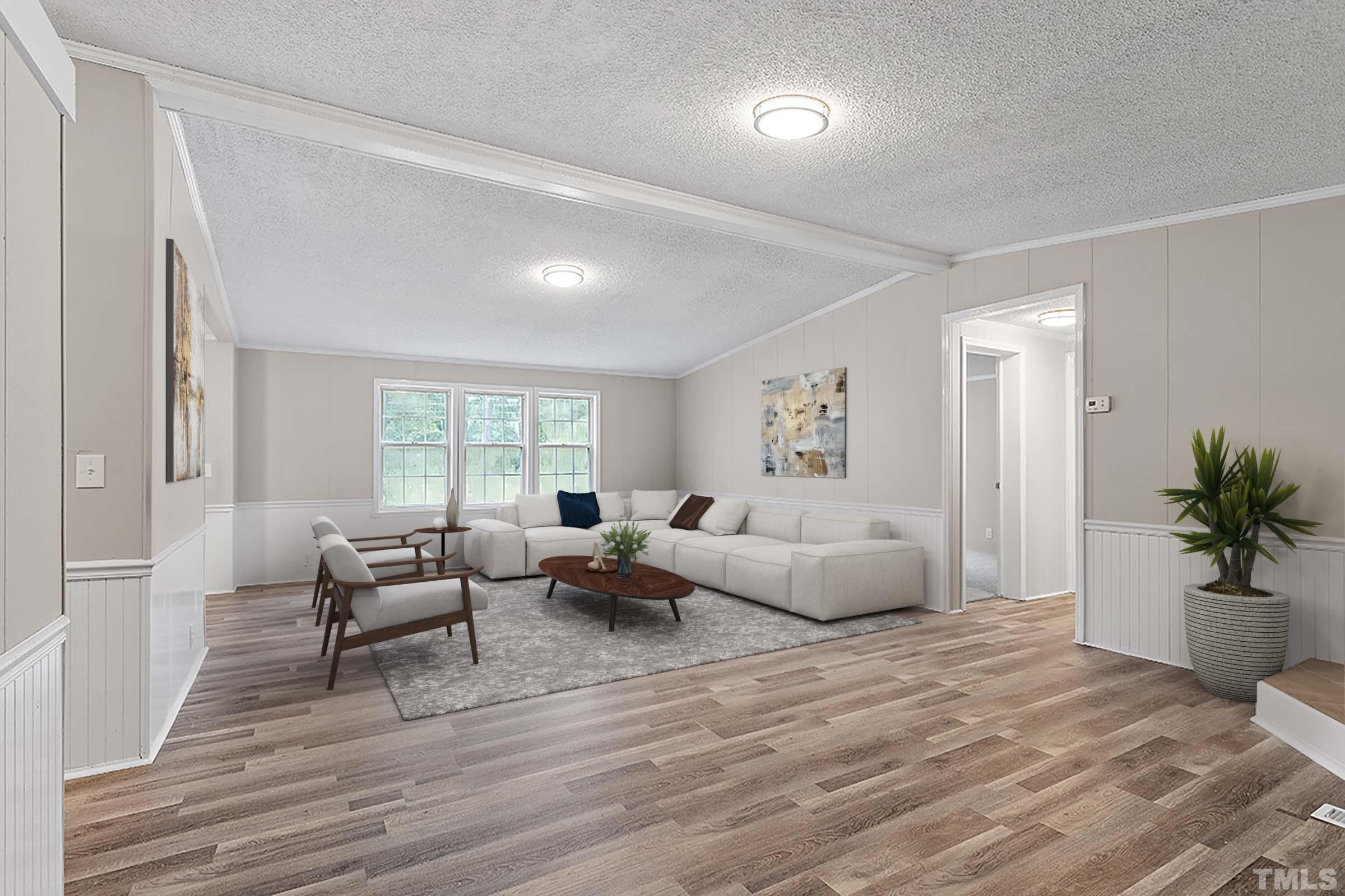 1002 Autry Road Lillington, NC 27546 - Photo 3 of 38 a living room with furniture and wooden floor