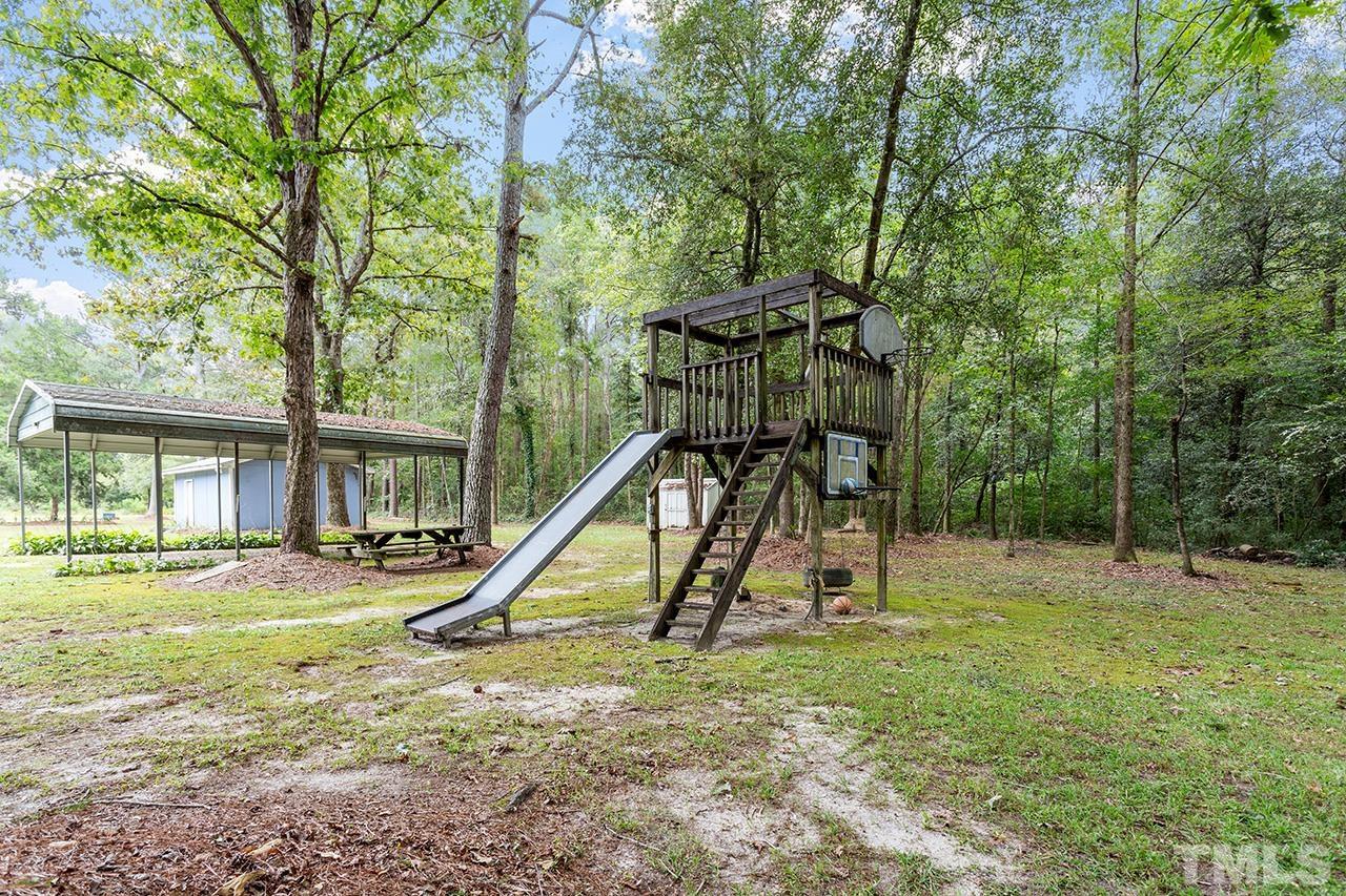 1002 Autry Road Lillington, NC 27546 - Photo 32 of 38 a view of a house with a park