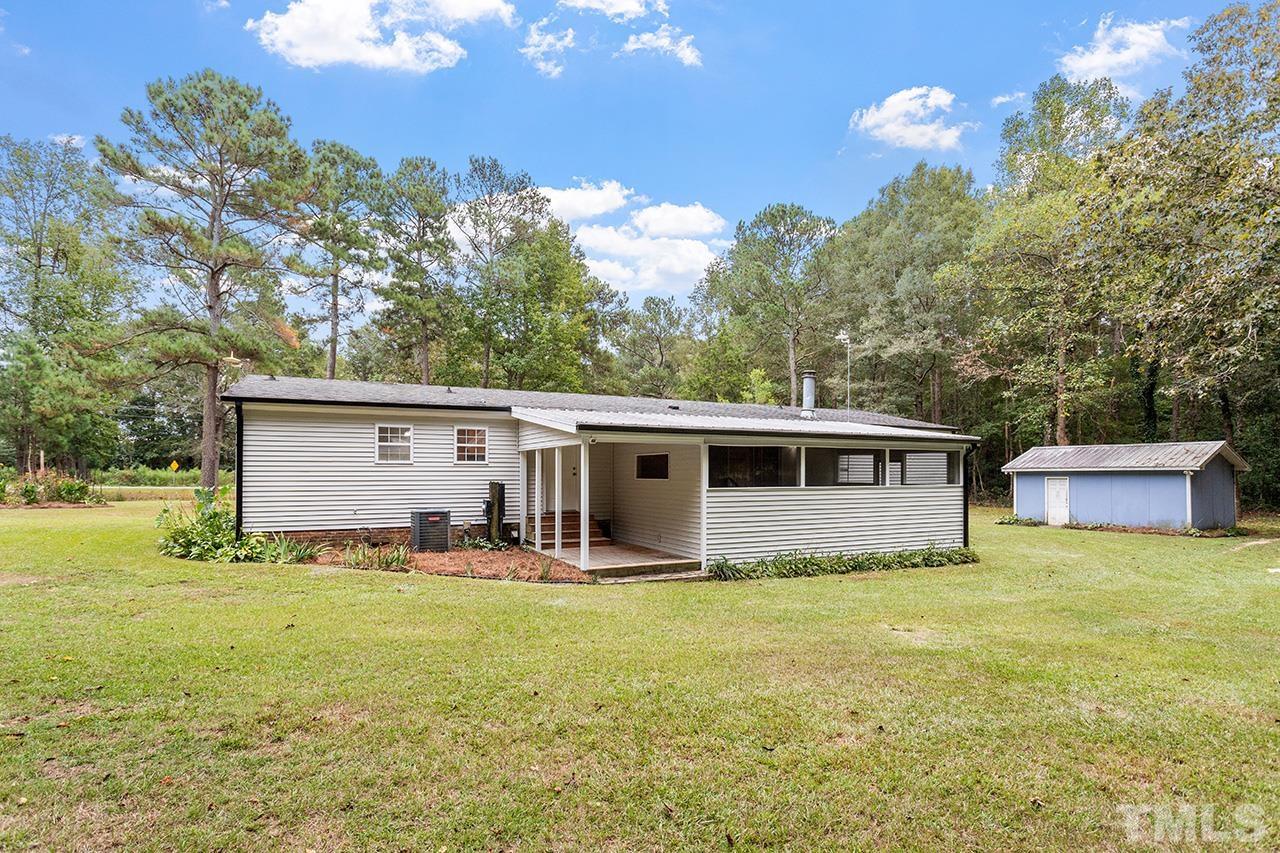 1002 Autry Road Lillington, NC 27546 - Photo 34 of 38 a house view with a garden space