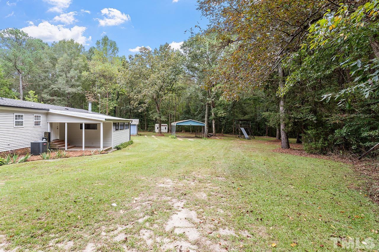 1002 Autry Road Lillington, NC 27546 - Photo 35 of 38 a house view with a seating space