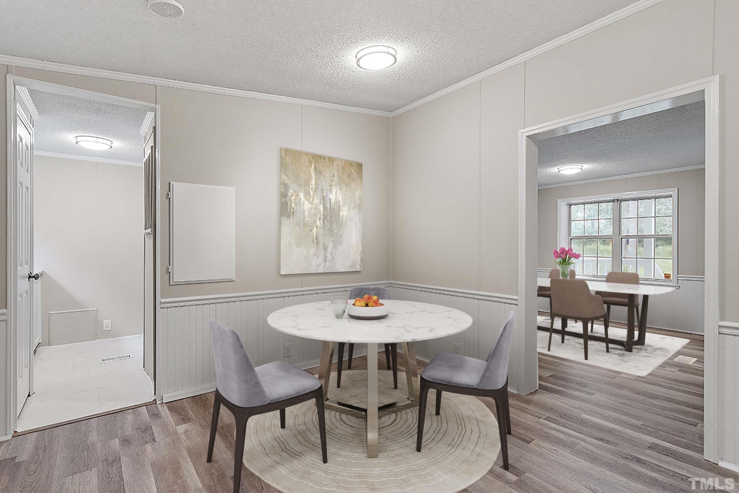 1002 Autry Road Lillington, NC 27546 - Photo 6 of 38 a dining room with furniture and wooden floor