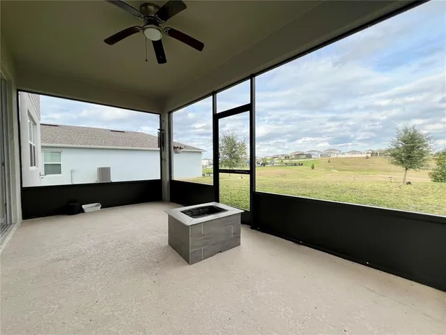 a view of an ocean and with furniture