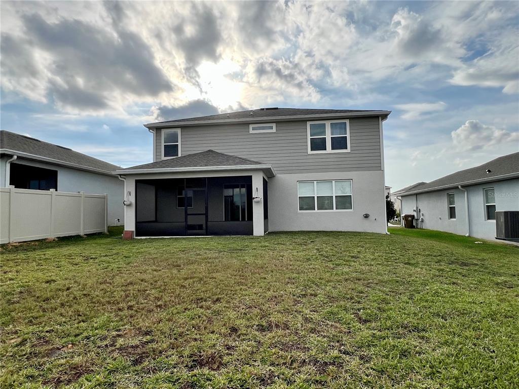 7488 Catania Loop Clermont, FL 34714 - Photo 17 of 22 a house view with a garden space