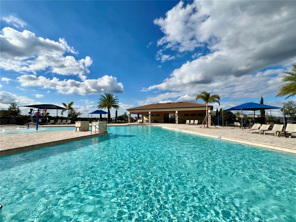 7488 Catania Loop Clermont, FL 34714 - Photo 28 of 31 a view of a house with sitting area and swimming pool
