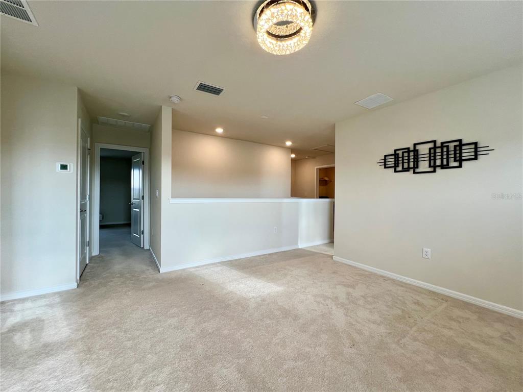 7488 Catania Loop Clermont, FL 34714 - Photo 8 of 22 an empty room with a empty space