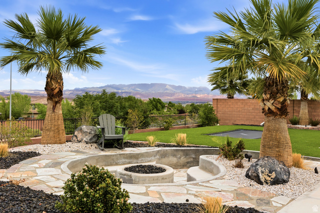 3694 South Jessamine Drive St. George, UT 84790 - Photo 1 of 1 View of patio / terrace with a fire pit and a mountain view