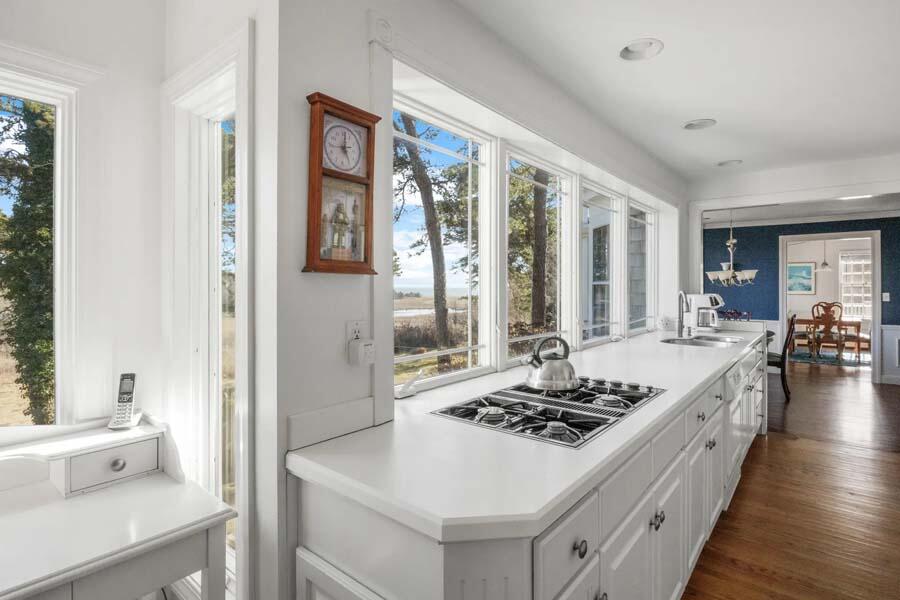17 Soundview Road Harwich, MA 02645 - Photo 12 of 37 a large white kitchen with a stove and a large window