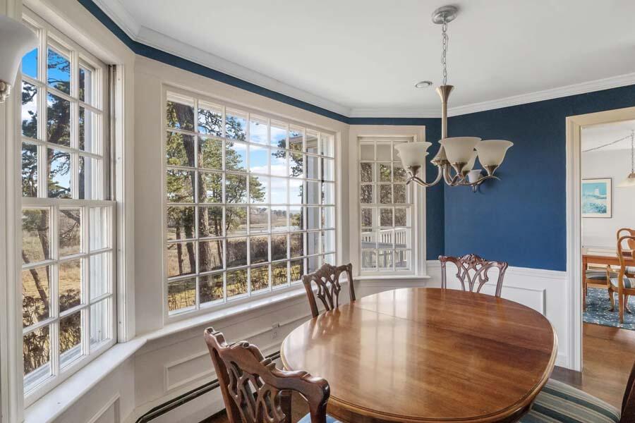17 Soundview Road Harwich, MA 02645 - Photo 13 of 37 a dining room with furniture a large window and chandelier