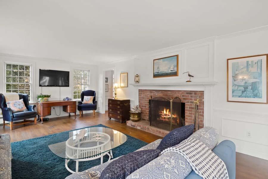 17 Soundview Road Harwich, MA 02645 - Photo 17 of 37 a living room with furniture and a fireplace