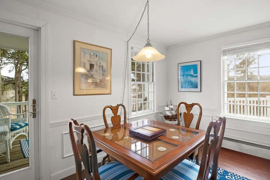 17 Soundview Road Harwich, MA 02645 - Photo 18 of 37 a view of a dining room and livingroom furniture wooden floor a rug and a chandelier